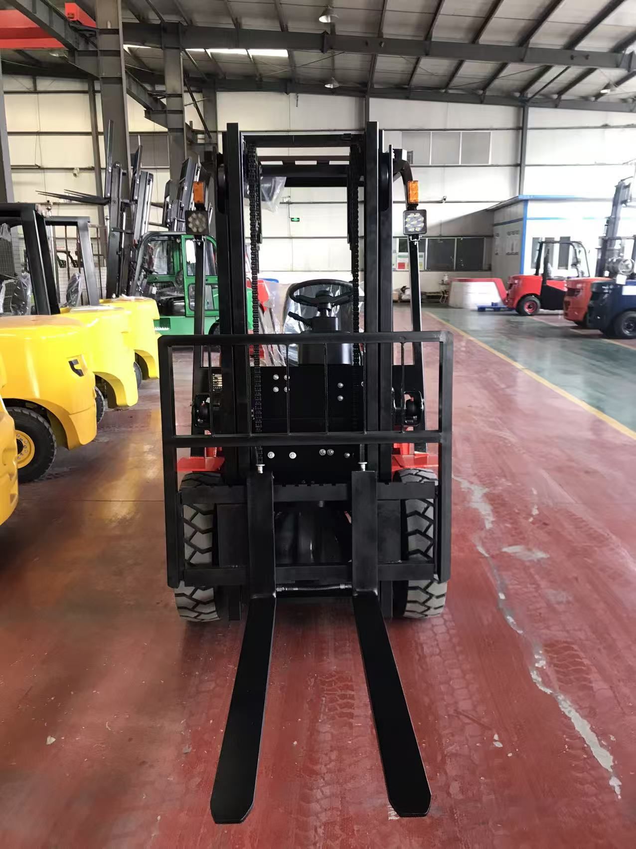 Liftray production line — forklifts assembled and lined up for inspection